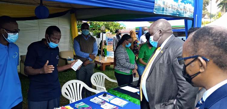 Tanzania Ports Authority TPA staff explaining to the minister the services they offer to Ugandan Traders