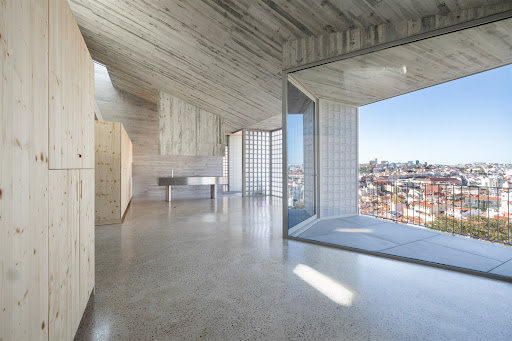 Modern living room with panoramic city view in this luxury apartment / penthouse for sale in Lisbon ($1,721,341)