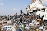 Waste reclaimers gather recyclables at the Simmer and Jack landfill site in Germiston. File Photo. 