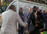 Stanley Menzo, Head Coach of Ajax Cape Town (l) and Steve Komphela, coach of Kaizer Chiefs (r) during the Absa Premiership 2016/17 football match between Ajax Cape Town and Kaizer Chiefs at Athlone Stadium, Cape Town on 25 February 2017.