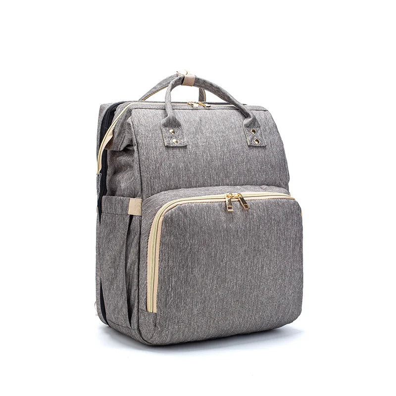 Sac à dos lit Mommy avec chargement USB, pliable, grande capacité, multifonction, idéal pour bébés, voyages et organisation familiale optimale.