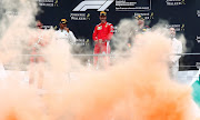 
Ferrari's Sebastian Vettel celebrates on the podium after winning the race while Mercedes' Lewis Hamilton and Red Bull's Max Verstappen look on  at Spa-Francorchamps, Stavelot - August 26, 2018.  