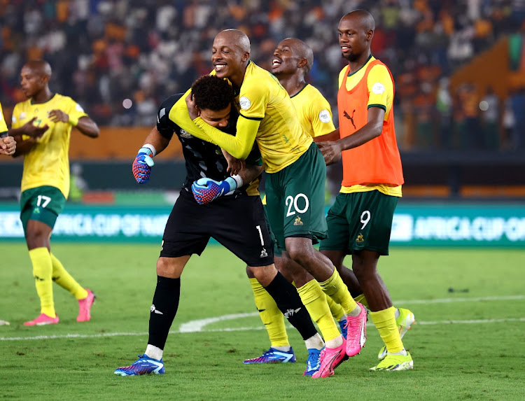 Bafana Bafana's Ronwen Williams and Khuliso Mudau celebrate after winning the penalty shootout in the Africa Cup of Nations third place playoff against Democratic Republic of the Congo at Stade Félix-Houphouët-Boigny in Abidjan, Ivory Coast on Saturday night.