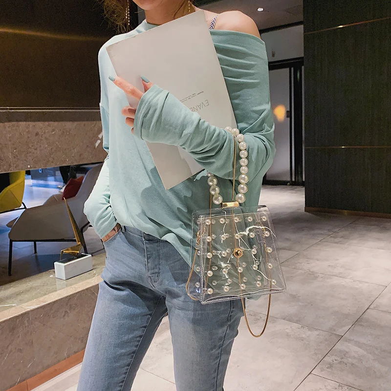 Dames transparante schoudertas met parels. Een stijlvolle tas die perfect is voor een elegante look en speciale gelegenheden.
