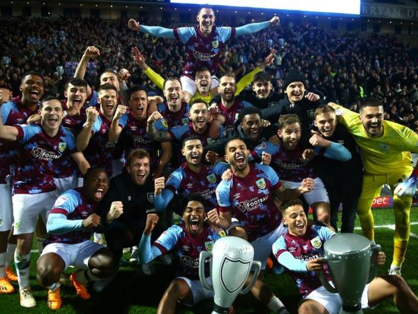 Burnley players celebrate their title glory