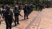 Police stand watch as Wits students protest on 4 October 2016.
