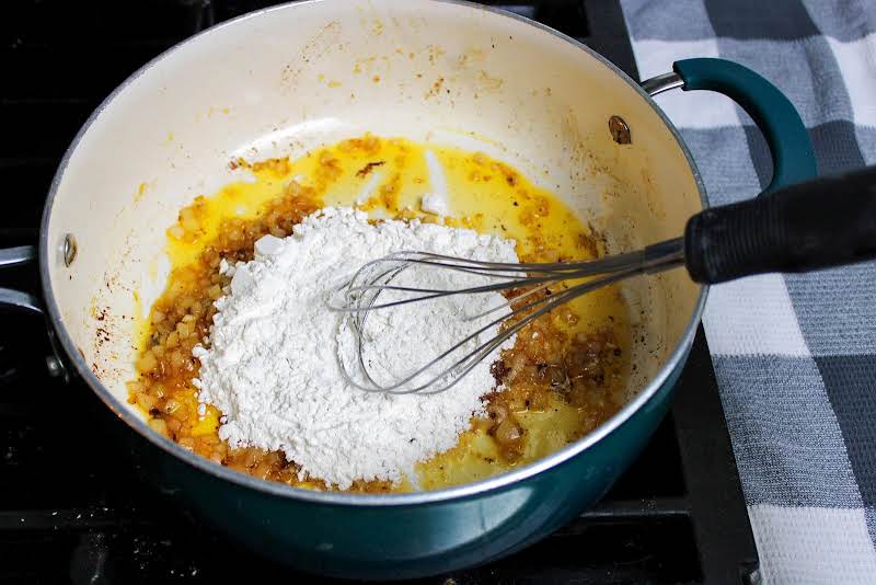 Stirring Flour Into Onions.