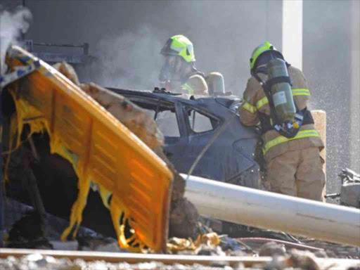 Several cars were torched by the fireball. REUTERS