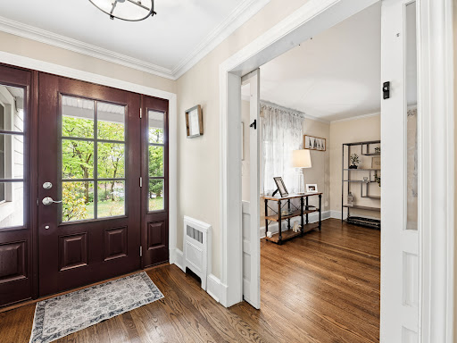 Entrance with double glass doors in this luxury property for sale in Port Washington ($1,629,000)