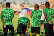 Stuart Baxter and Mark Fish during a team talk before training in Cairo on July 7 2019.   