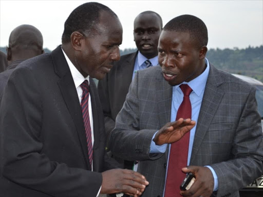 Nandi Governor Cleophas Lagat and Senator Stephen Sang converse on March 27 last year /BARRY SALIL