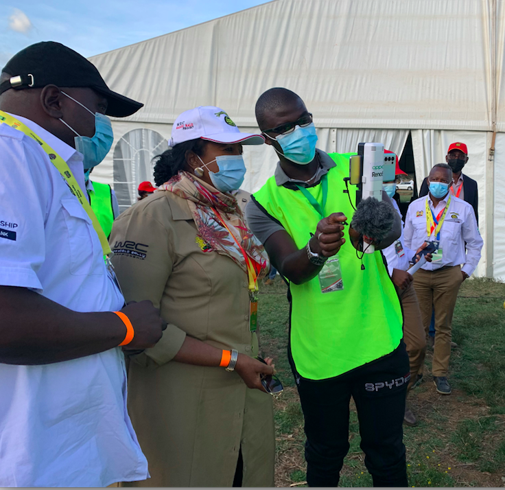 Royal Media Services Sports Editor, Mike Okinyi explains to Sports Cabinet Secretary Dr. Amina Mohammed and Principal Secretary Joe Okudo how digital journalism was at play during the ARC Equator Rally In Naivasha over the weekend