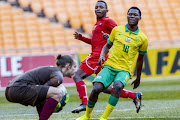 Kobamelo Kodisang of South Africa and Tani-tani Nauseb and keeper Mirko Wollf of Namibia during the 2017 CAF U20 African Cup of Nations 2nd Leg Qualifier between South Africa and Namibia at FNB Stadium on June 11, 2016 in Johannesburg, South Africa. 