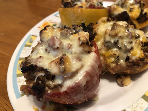 Peppers stuffed with ground meat, re-fried beans, and silly cow cheese