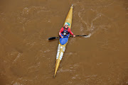  A competitor reacts as he paddles under Dusi bridge on the first day of the Dusi Canoe Marathon. 