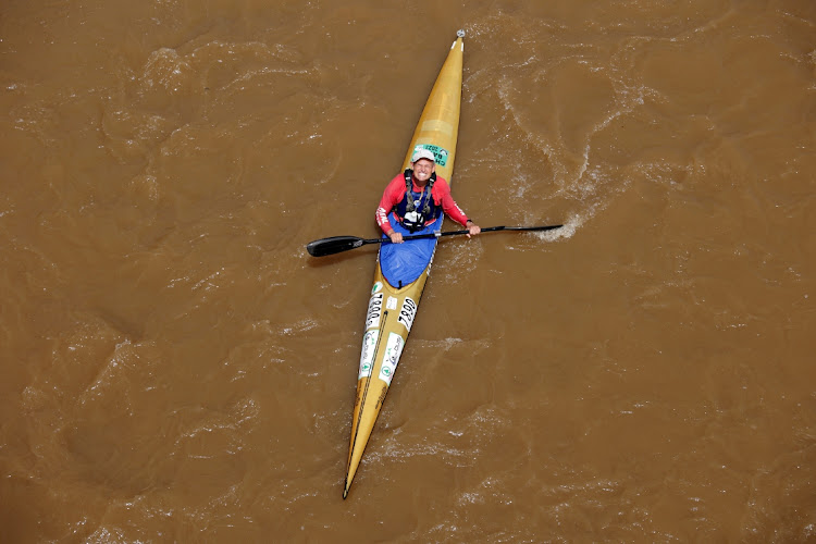 A competitor reacts as he paddles under Dusi bridge on the first day of the Dusi Canoe Marathon.