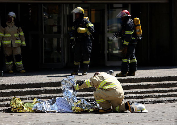 A firefighter fell to his death while battling a blaze on the upper floors of a government building in the Johannesburg CBD on Wednesday morning.