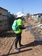 The community health worker, screening people at an  informal settlement in the Atteridgeville area.