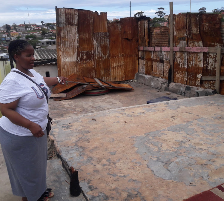 Ncumisa Yoyo shows the fire damage at the Zamani Day Care Centre she founded in Duncan Village, East London