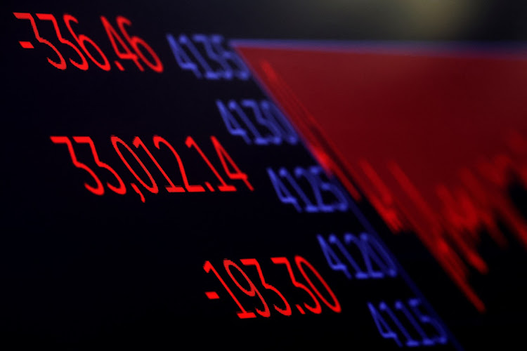 A screen displays the closing numbers for the Dow Jones Industrial Average on the floor of the New York Stock Exchange in New York City, US. File photo: BRENDAN MCDERMID/REUTERS