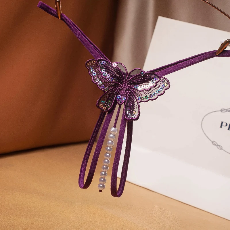 Calcinha Tanga Sexy Feminina Transparente com Pérolas. Desperte a sensualidade com esta lingerie elegante e confortável. Sinta-se confiante e irresistível.