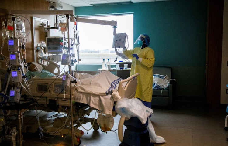 A nurse performs a wellness check of a coronavirus disease (COVID-19) patient inside the intensive care unit of Humber River Hospital in Toronto, Ontario, Canada April 15, 2021.