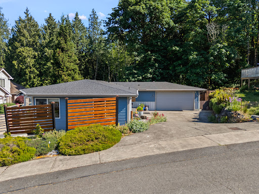 Blue house with wooden fence in this luxury house for sale in Port Orchard ($725,000 - 169 m²)