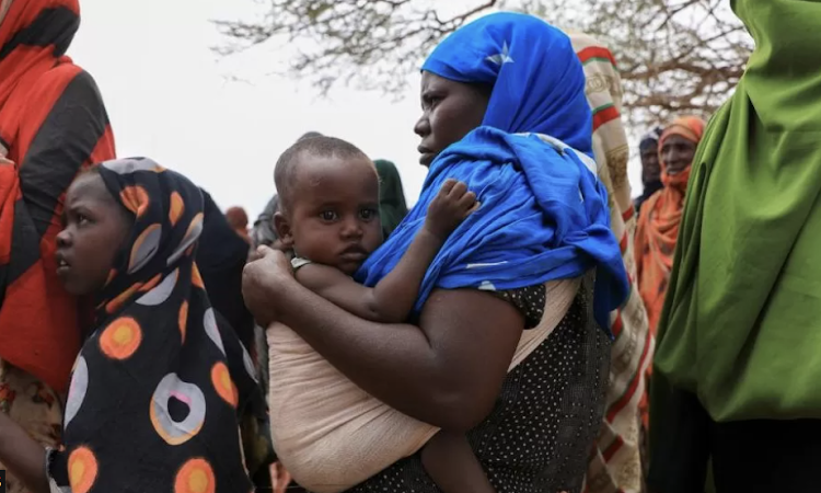 Ethiopians queuing to receive food aid at a camp in Gode last year