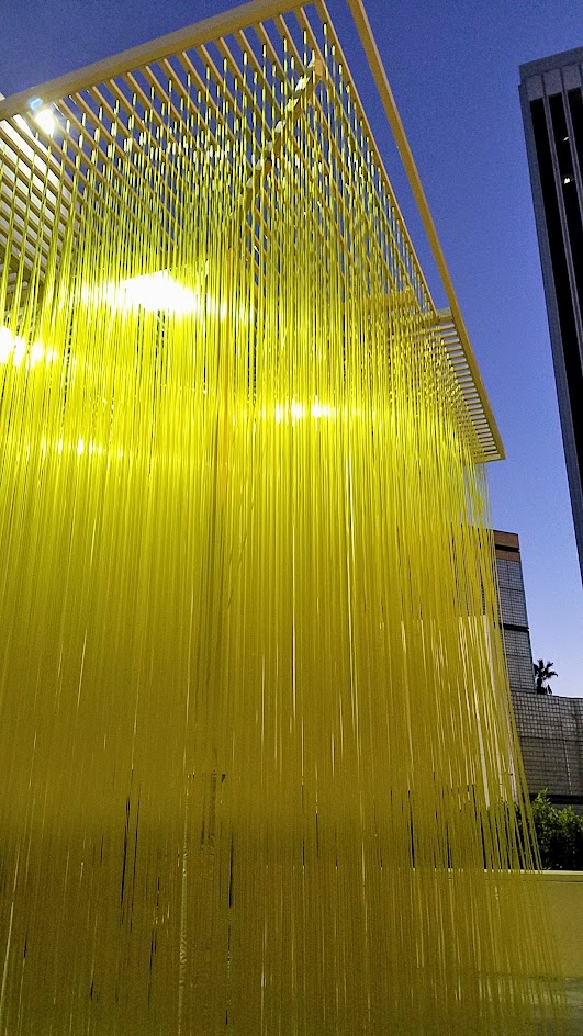 Jesús Rafael Soto's Penetrable, also known as Yellow Noodles or Spaghetti sometimes. It's a grid simply with yellow plastic hoses that viewers can interact with for free, on loan until Feb 2017 at LACMA in the main plaza