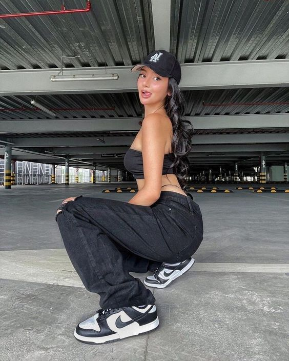 Picture of a lady rocking the crop top and jean with the sneakers