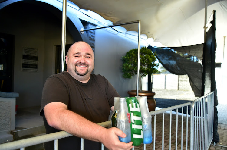 Candy’s owner Charl Muller and the new dance poles he has had installed for the club’s special drive-through adult shows.