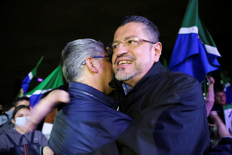 Costa Rica’s presidential candidate Rodrigo Chaves of the Social Democratic Progress Party is greeted by a supporter in San Jose, Costa Rica, March 25 2022. Picture: MAYELA LOPEZ/REUTERS