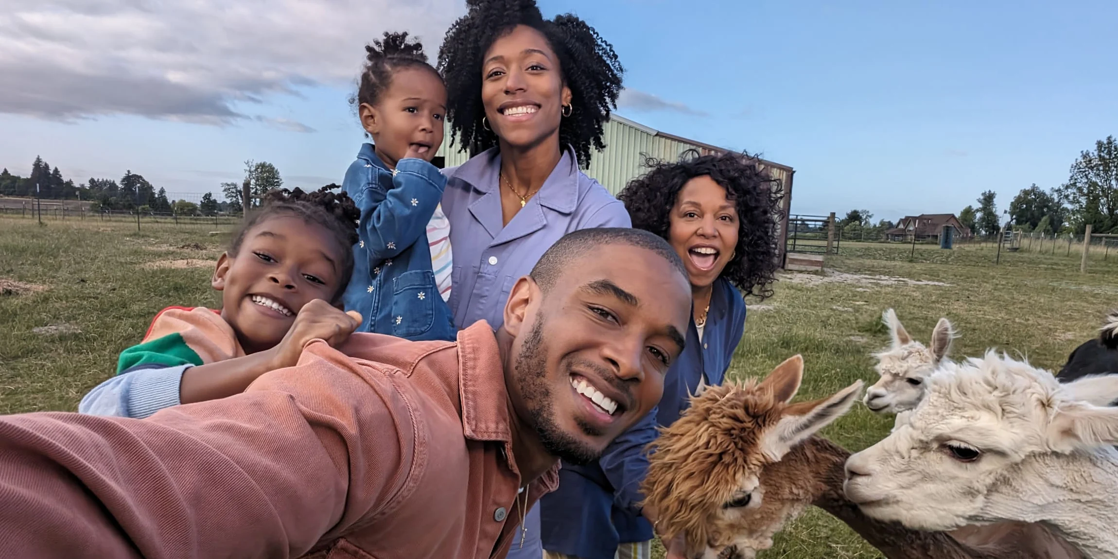 Five people pose for a selfie alongside some llamas. The details of their skin, hair and clothing are brilliantly captured by Pixel 8 Pro.