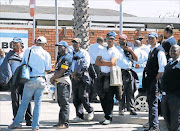 Algoa bus company employees mill around the Pearl Road depot during strike action in April.