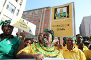 Supporters of former president Jacob Zuma march to the Durban High Court on April 6 2018 as he makes his first court appearance.

