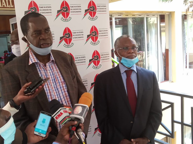 NCIC commissioner Philip Okundi (left) with the chairperson Samuel Kobia address the press after the event in Narok on Friday.