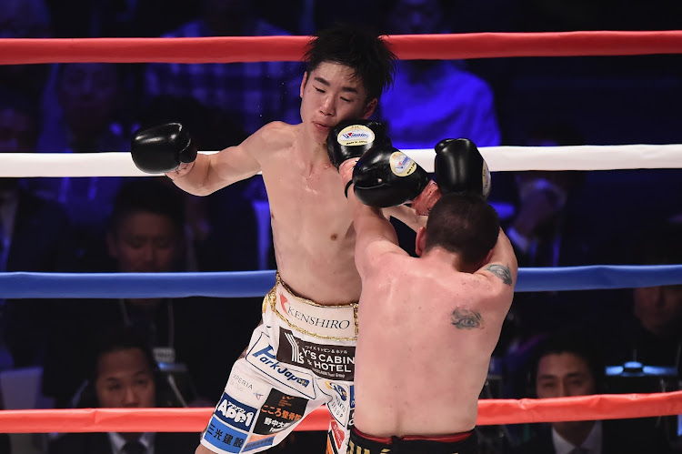 Kenshiro Teraji of Japan, left, in action against Saul Juarez of Mexico in 2018.