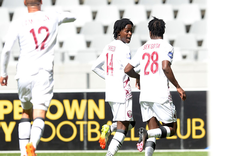 Swallows FC striker Kgaogelo Sekgota celebrates with teammates Moikhomotsi and Ruzaigh Gamaldien during a DStv Premiership 1-1 draw against Cape Town City at the Cape Town Stadium in Cape Town on February 21 2021.