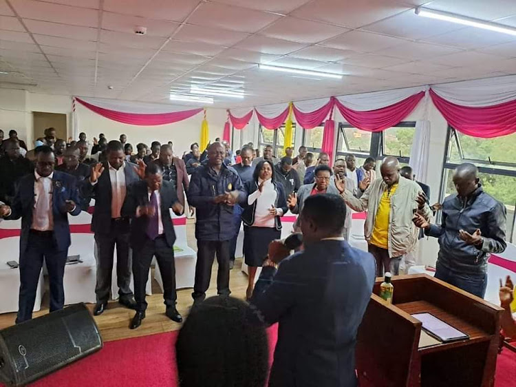 Meru County staff praying and worshipping during the launch of Meru staff prayer alter on March 17, 2023.