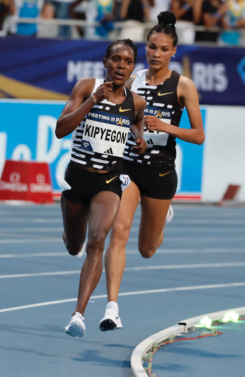 Faith Kipyegon (L) of Kenya and Letesenbet Gidey of Ethiopia compete during the women's 5000m final at the Diamond League Athletics Meeting of Paris, in France, June 9, 2023.