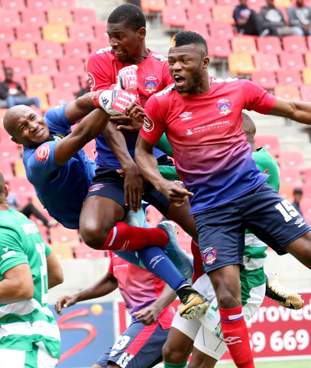 Bloemfontein goalie, Given Mashikinya, left, makes attempts to save the ball as Chippa United’s Sandile Mthethwa centre, and Augustine Kwem launch an attack at goal during their Absa Premier League match at the Nelson Mandela Bay Stadium in Port Elizabeth on Sunday