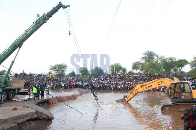 The ill-fated bus is retreived from River Enziu on December 5, 2021/ANDREW KASUKU