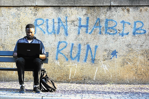 ENGINEERING THE FUTURE: Tiisetso Leshilo, a second-year mechanical engineering student at the Wits University, gets on with his studies in a quiet corner while the #FeesMustFall leadership debates student fees following a week of unrest and marches on the campus