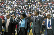 Ahmed Kathrada, Winnie Mandela, Nelson Mandela and Walter Sisulu at an ANC welcome rally at the FNB Stadium in Soweto in 1990.