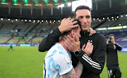 Lionel Messi of Argentina celebrates with head coach Lionel Scaloni after winning the final of Copa America Brazil 2021 against Brazil at Maracana Stadium in Rio de Janeiro on July 10 2021. 