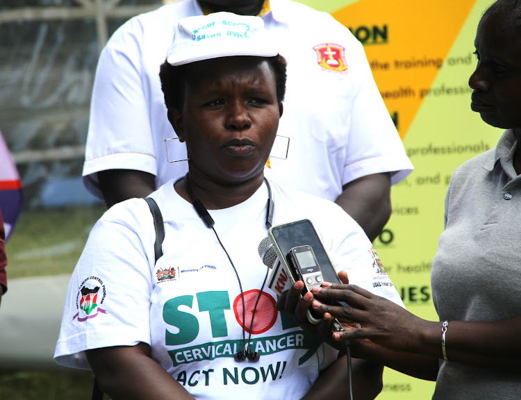 Dr. Joyfrida Chepchumba briefing the media on cancer screening during a free medical screening at Drysfarm in Ainabkjoi constituency