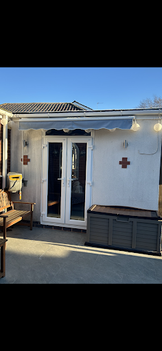 Garage converted into a bedroom and en suite also leading to back garden via double doors.