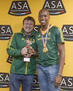 World chapmion Luvo Manyonga and his coach Neil Cornelius during the arrival of Luvo Manyonga, IAAF World Championship Long Jump Gold Medal winner at OR Tambo International Airport on August 26, 2017 in Johannesburg.