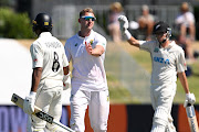 Neil Brand congratulates New Zealand's Rachin Ravindra after bowling him for 240 in the first Test in Mt Maunganui. Brand took 6/119.