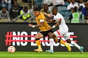 Keagan Dolly, captain of Kaizer Chiefs and Azola Matrose of Chippa United during the DStv Premiership match at Moses Mabhida Stadium on October 15.